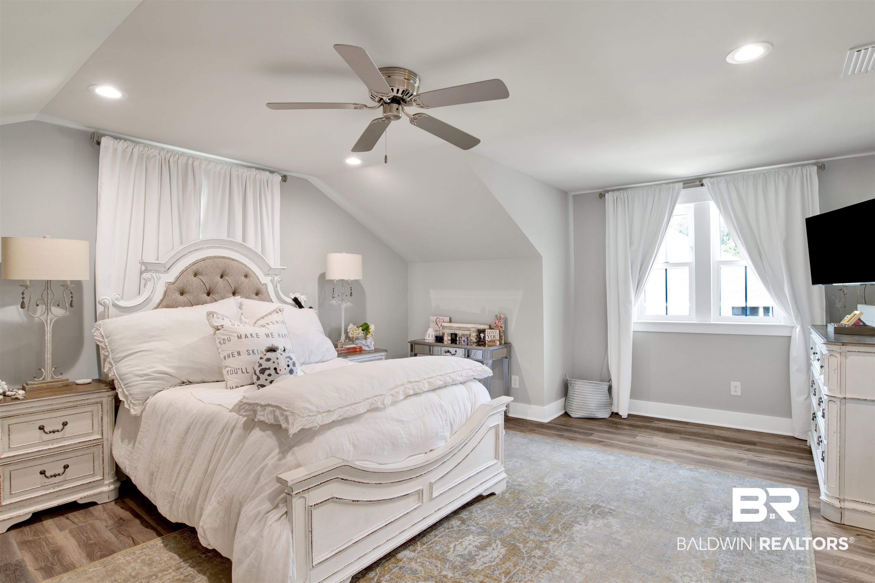 21621 Veranda Boulevard Fairhope, AL 36532 - Photo 19 of 51 Bedroom featuring ceiling fan, recessed lighting, baseboards, wood finished floors, and lofted ceiling