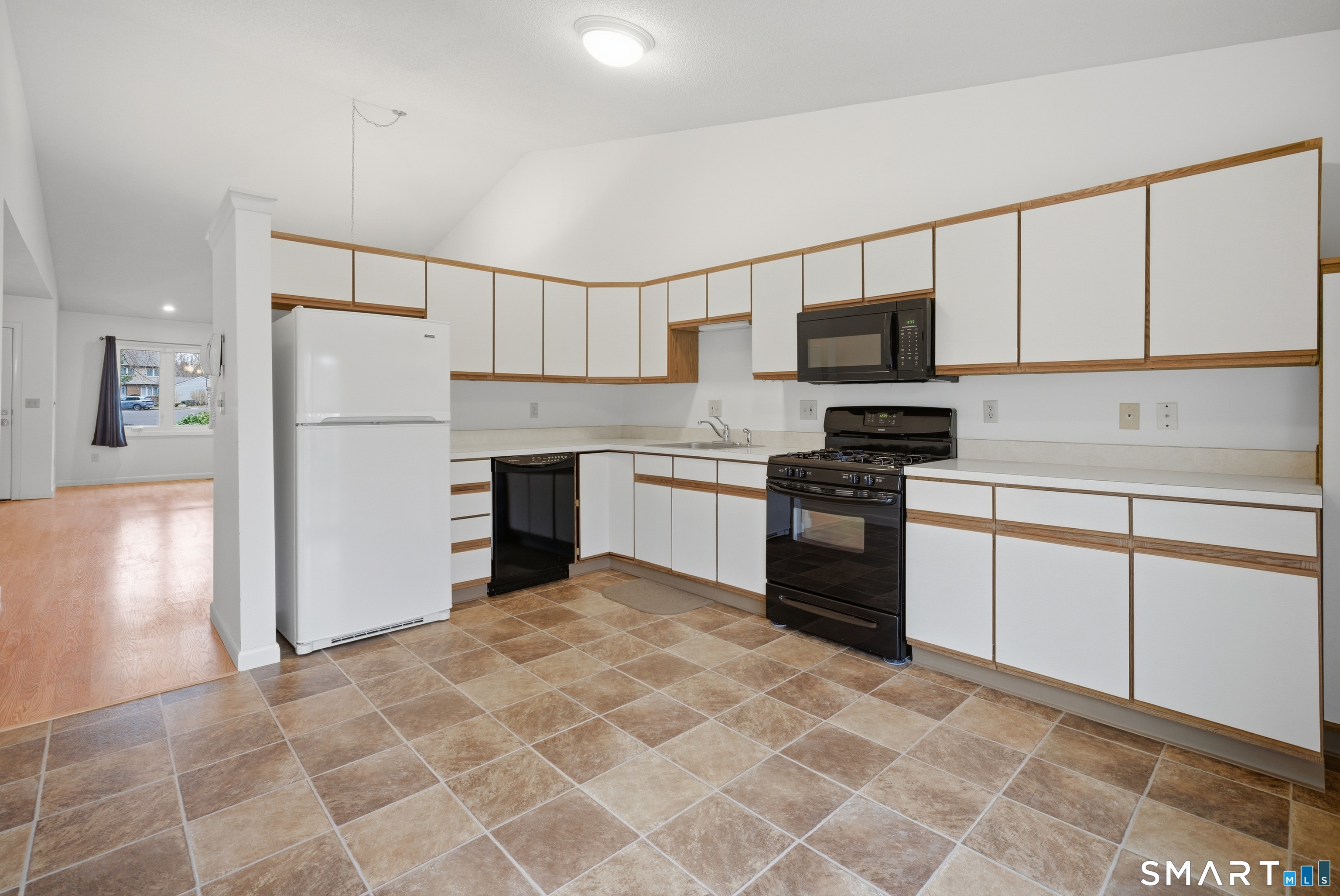 449 South Main Street, Unit 90 Manchester, CT 06040 - Photo 14 of 39 a kitchen with granite countertop a refrigerator stove top oven and sink
