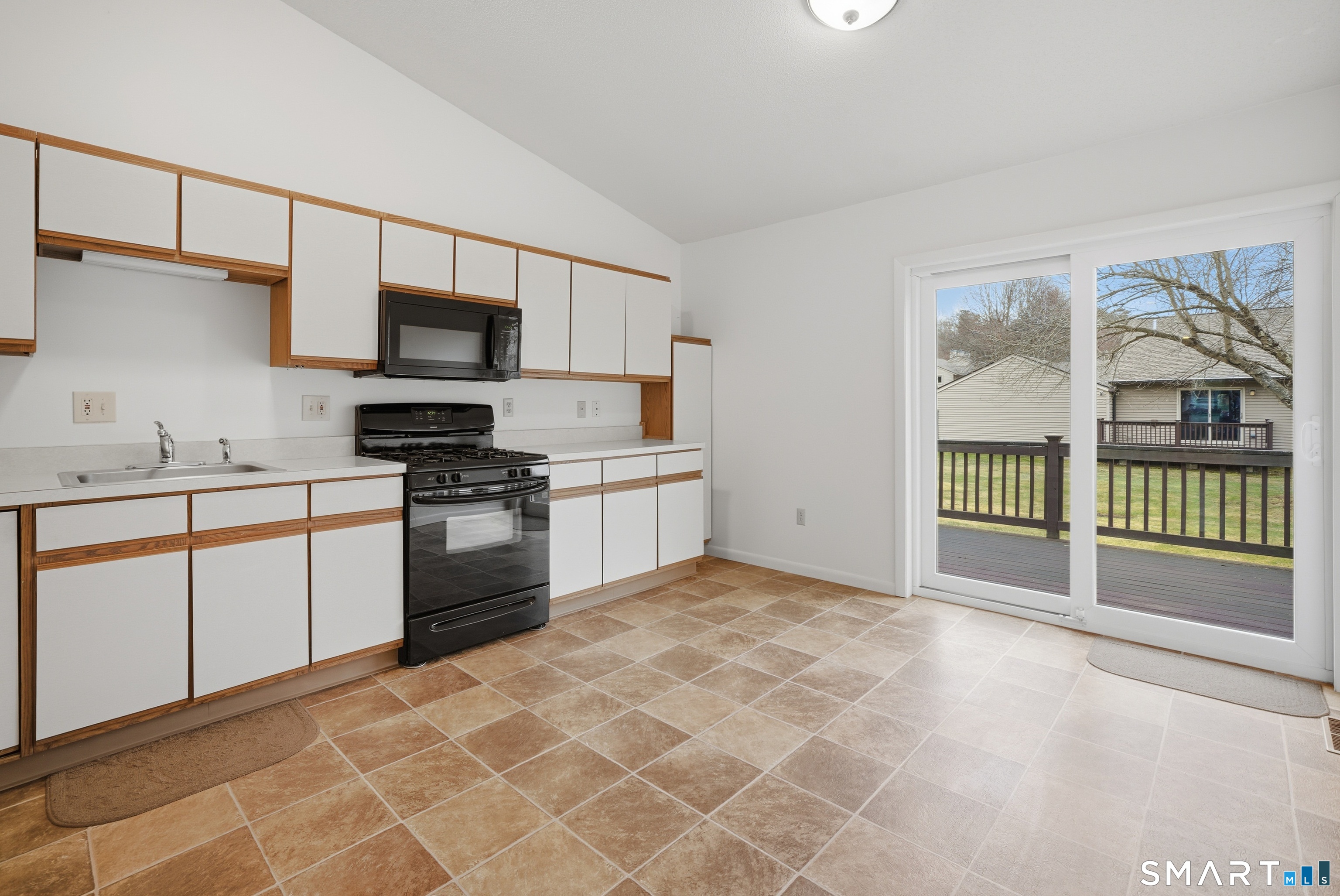 449 South Main Street, Unit 90 Manchester, CT 06040 - Photo 16 of 39 a kitchen with stainless steel appliances granite countertop a stove a sink and a refrigerator