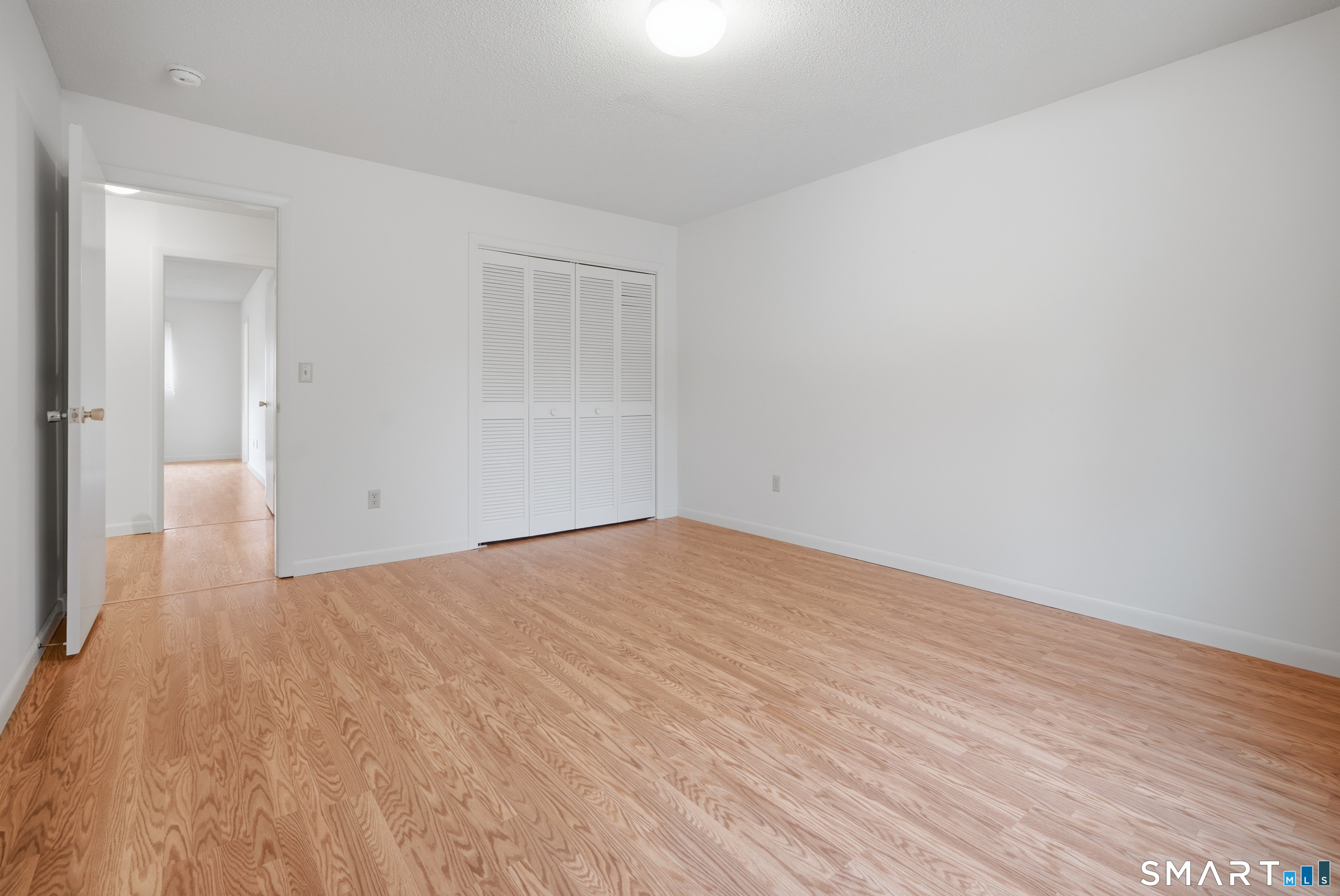 449 South Main Street, Unit 90 Manchester, CT 06040 - Photo 22 of 39 a view of empty room with wooden floor