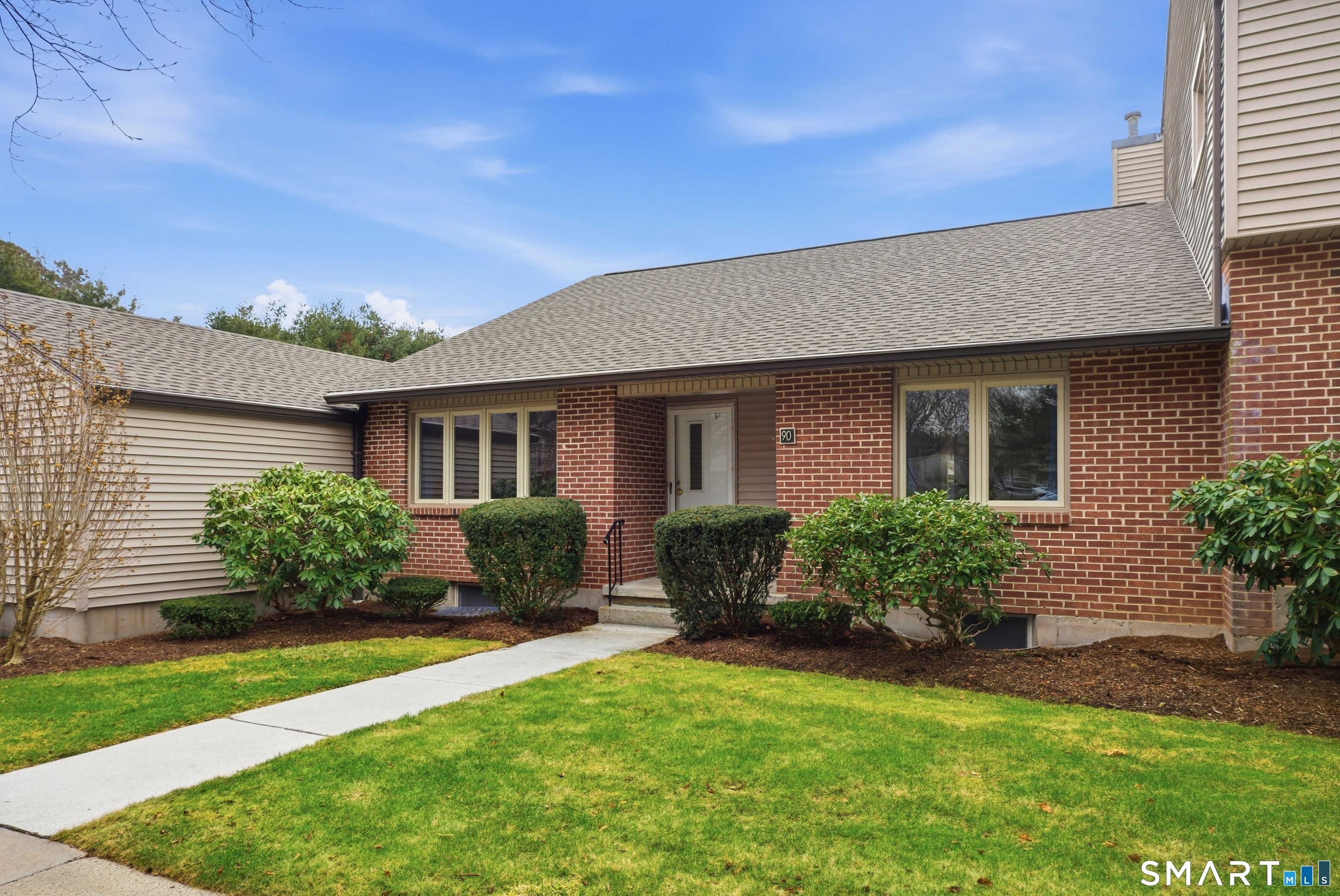 449 South Main Street, Unit 90 Manchester, CT 06040 - Photo 3 of 39 a front view of a house with a yard