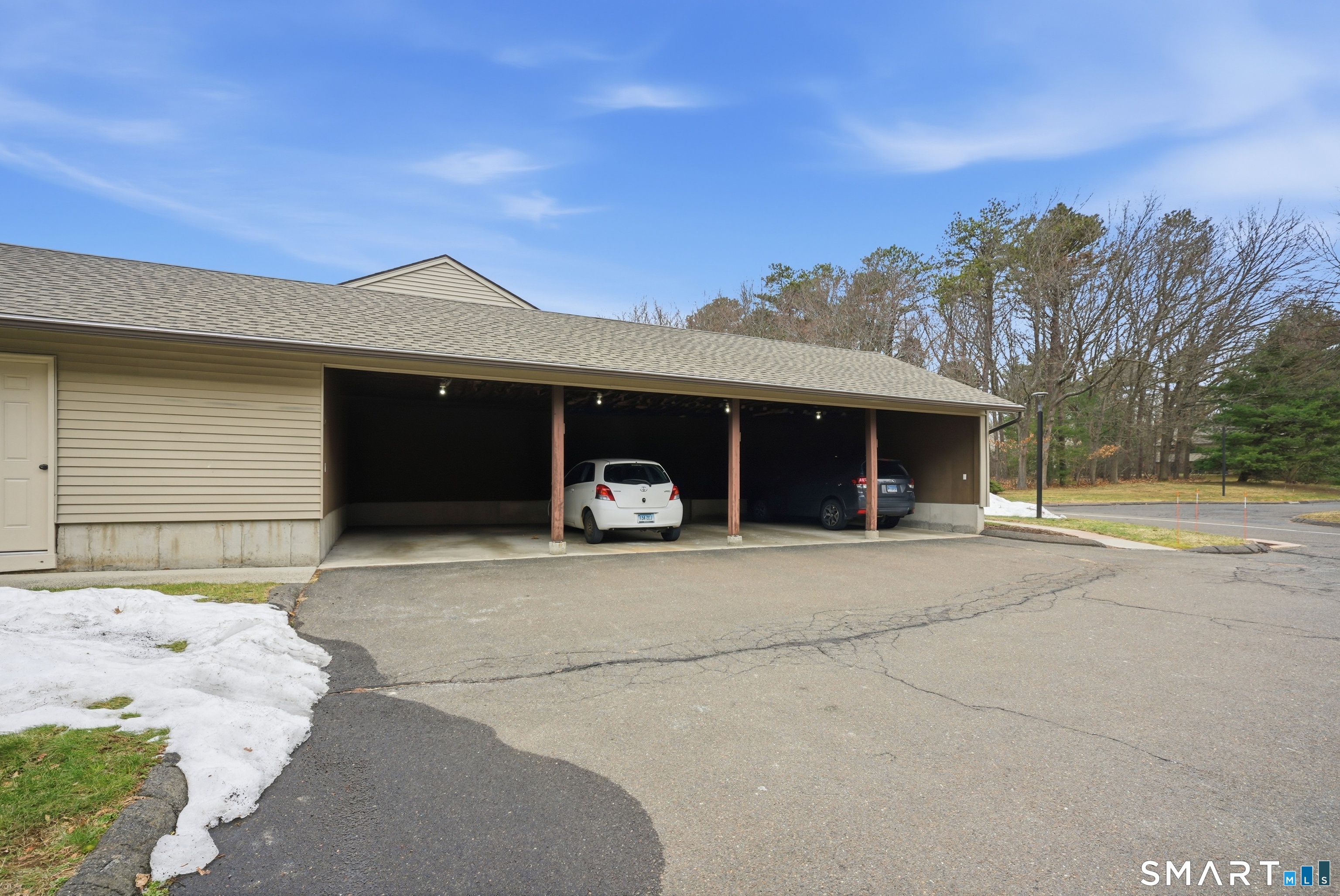 449 South Main Street, Unit 90 Manchester, CT 06040 - Photo 38 of 39 a front view of a house with a yard and a garage