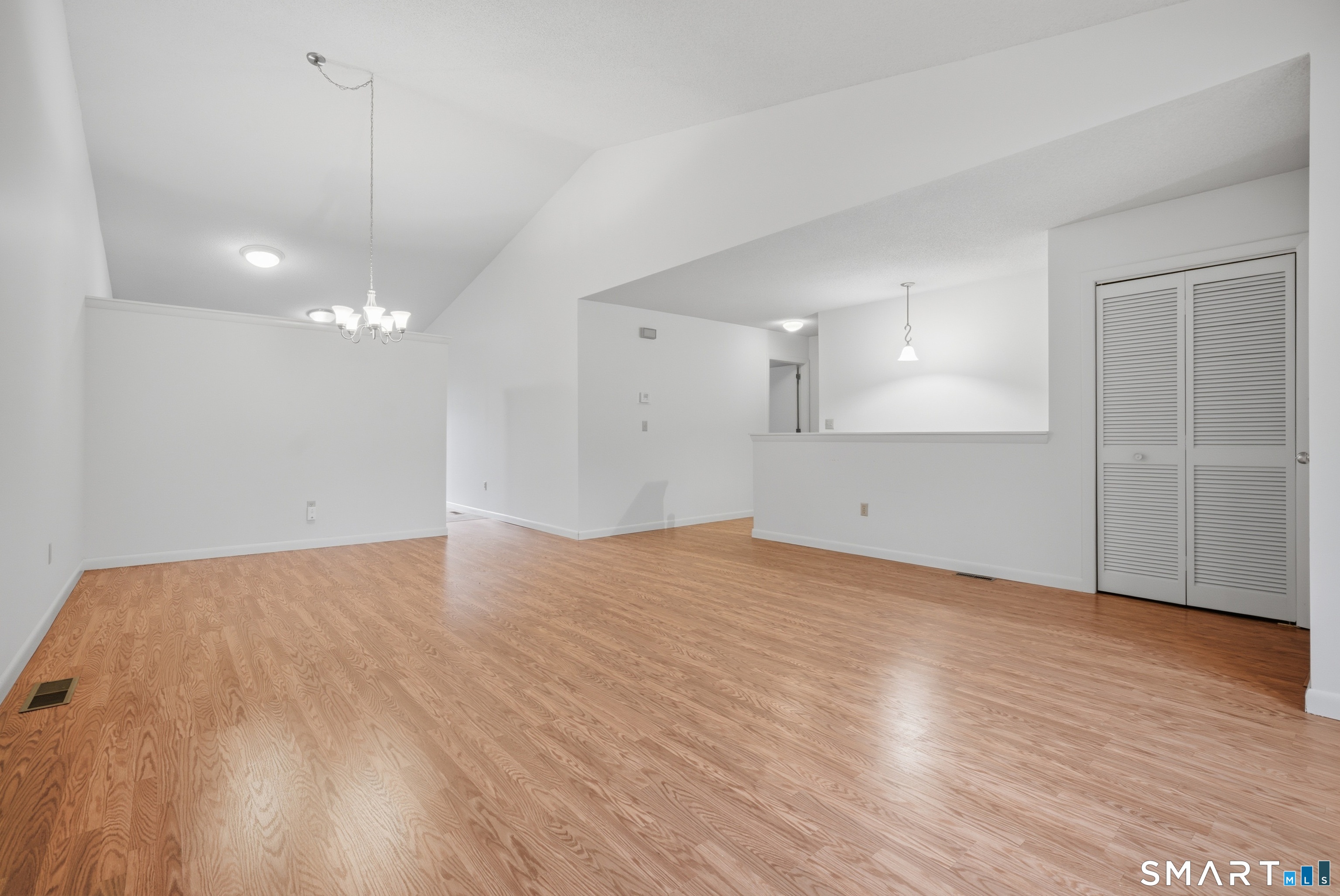 449 South Main Street, Unit 90 Manchester, CT 06040 - Photo 7 of 39 a view of empty room with wooden floor and fan