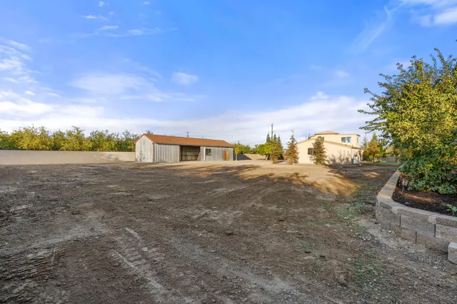 a view of a yard with an outdoor space