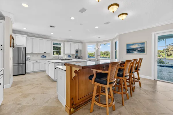 a kitchen with stainless steel appliances granite countertop a stove and a sink