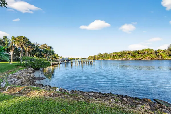 an aerial view of a house with a yard and garden