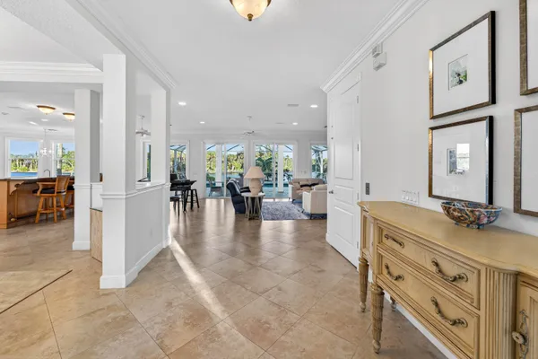a kitchen with stainless steel appliances granite countertop a table and chairs
