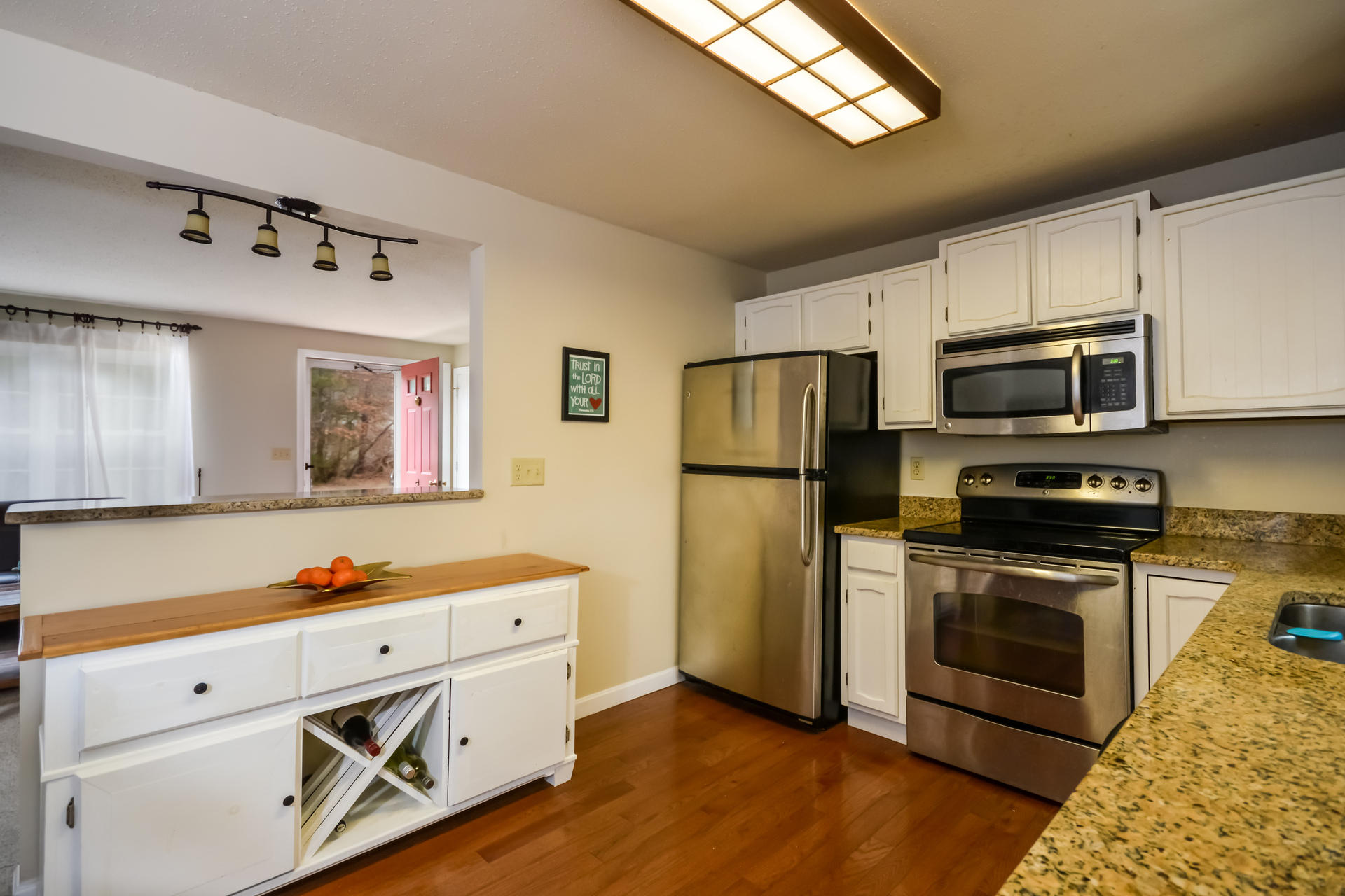 70 Ensign Road Centerville, MA 02632 - Photo 8 of 26 a kitchen with stainless steel appliances a stove microwave and refrigerator