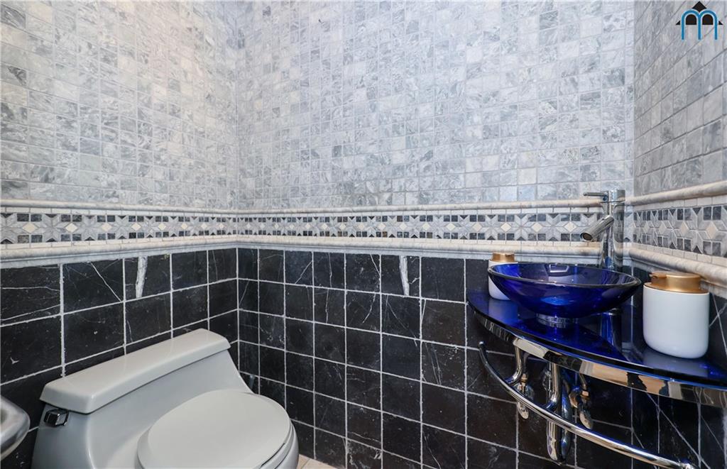 8909 Ridge Boulevard Brooklyn, NY 11209 - Photo 12 of 31 a bathroom with a toilet