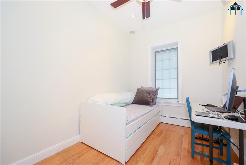 8909 Ridge Boulevard Brooklyn, NY 11209 - Photo 18 of 31 a living room with furniture and a flat screen tv