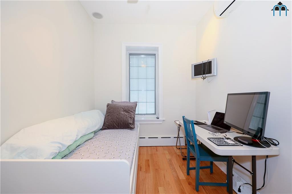8909 Ridge Boulevard Brooklyn, NY 11209 - Photo 19 of 31 a living room with furniture and a laptop computer on a table