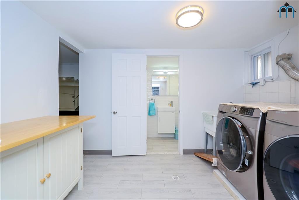 8909 Ridge Boulevard Brooklyn, NY 11209 - Photo 24 of 31 a view of a storage & utility room with washer and dryer