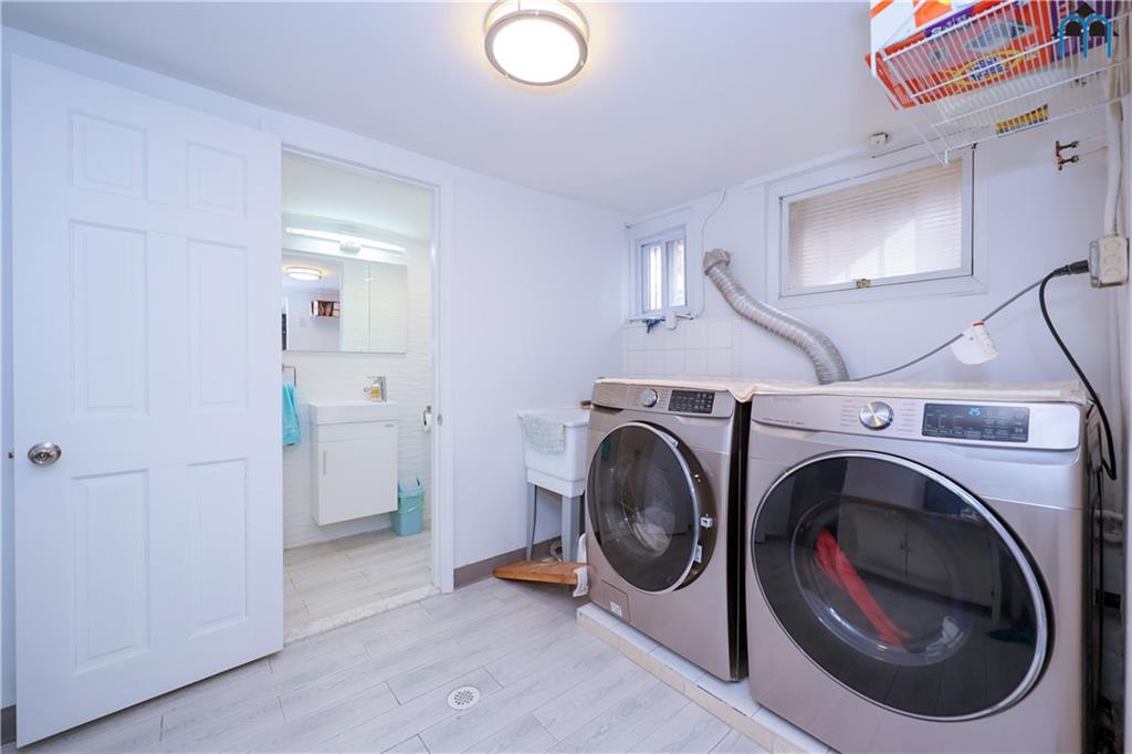8909 Ridge Boulevard Brooklyn, NY 11209 - Photo 25 of 31 a utility room with sink dryer and washer