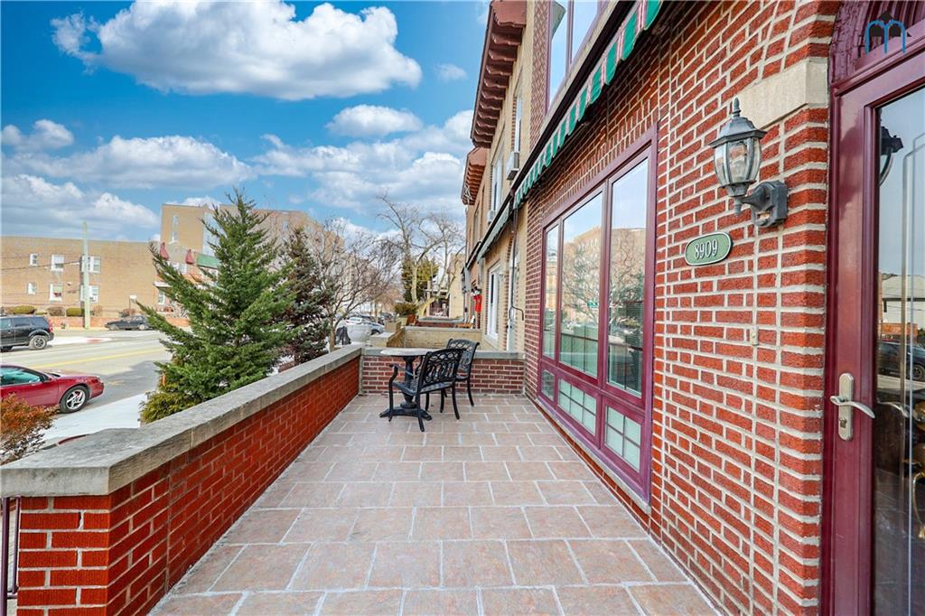 8909 Ridge Boulevard Brooklyn, NY 11209 - Photo 6 of 31 a balcony with chairs and a table
