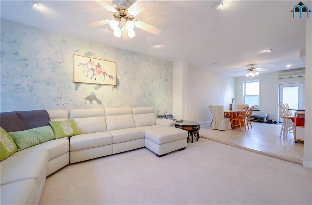 8909 Ridge Boulevard Brooklyn, NY 11209 - Photo 7 of 31 a living room with furniture and wooden floor