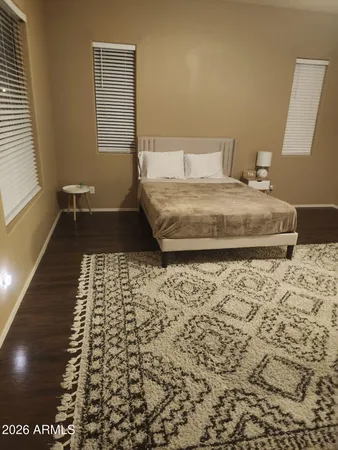 a view of room with window and hardwood floor