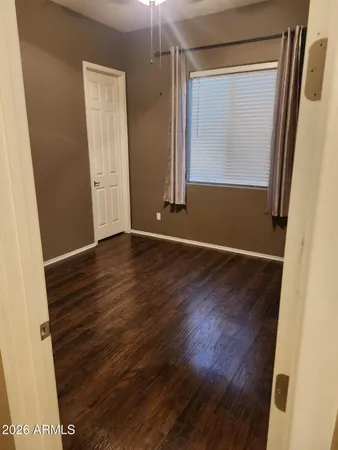 an empty room with wooden floor