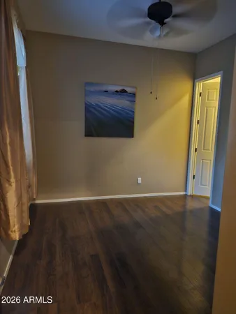 a bathroom with double vanity and a mirror