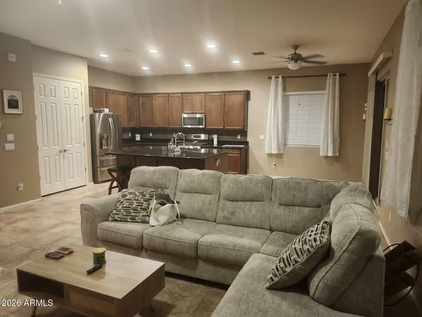 a kitchen with sink stove and refrigerator
