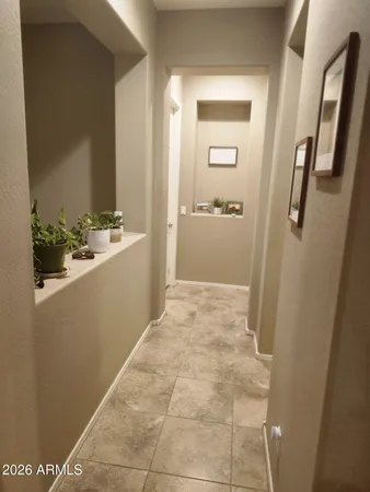 a bedroom with a bed and a mirror