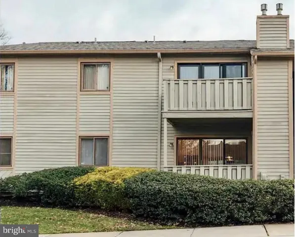 a brick house with a large windows