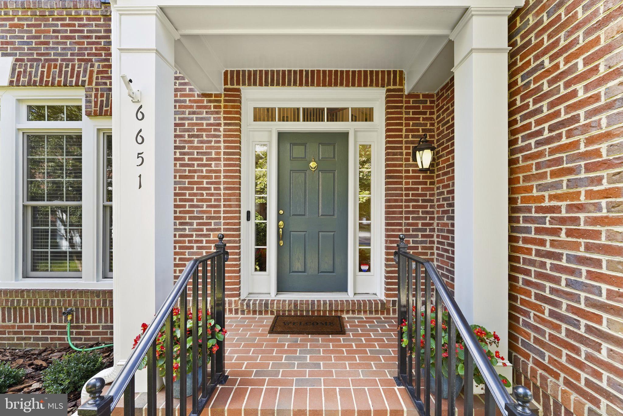 6651 Avignon Boulevard Falls Church, VA 22043 - Photo 2 of 51 a front view of a house with a glass door