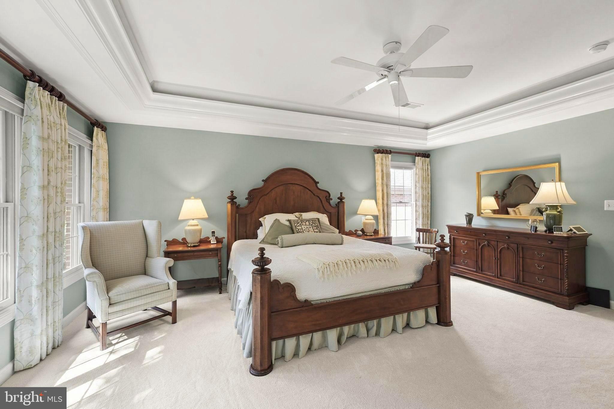 6651 Avignon Boulevard Falls Church, VA 22043 - Photo 21 of 51 a bedroom with a bed and a chandelier