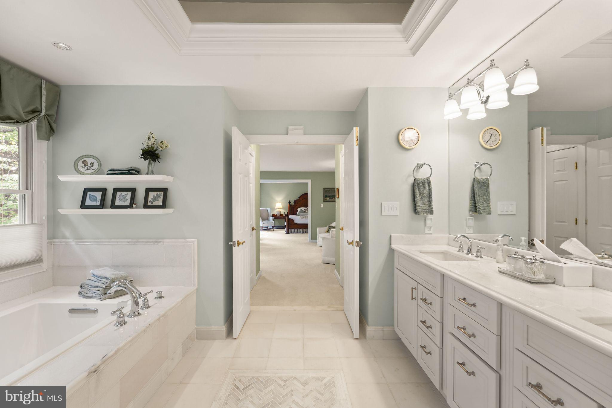 6651 Avignon Boulevard Falls Church, VA 22043 - Photo 25 of 51 a spacious en suite bathroom with double vanity a mirror and a bathtub