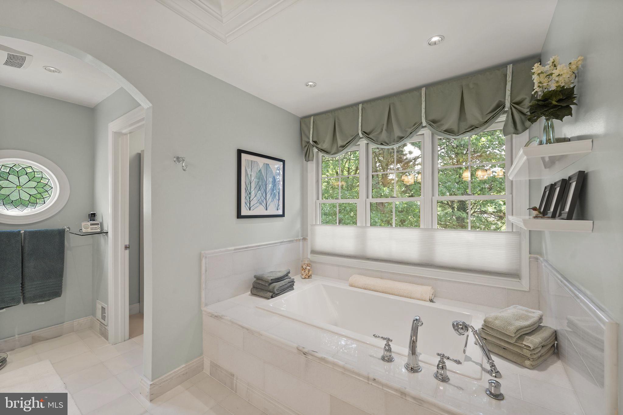 6651 Avignon Boulevard Falls Church, VA 22043 - Photo 26 of 51 a bathroom with a tub sink and mirror