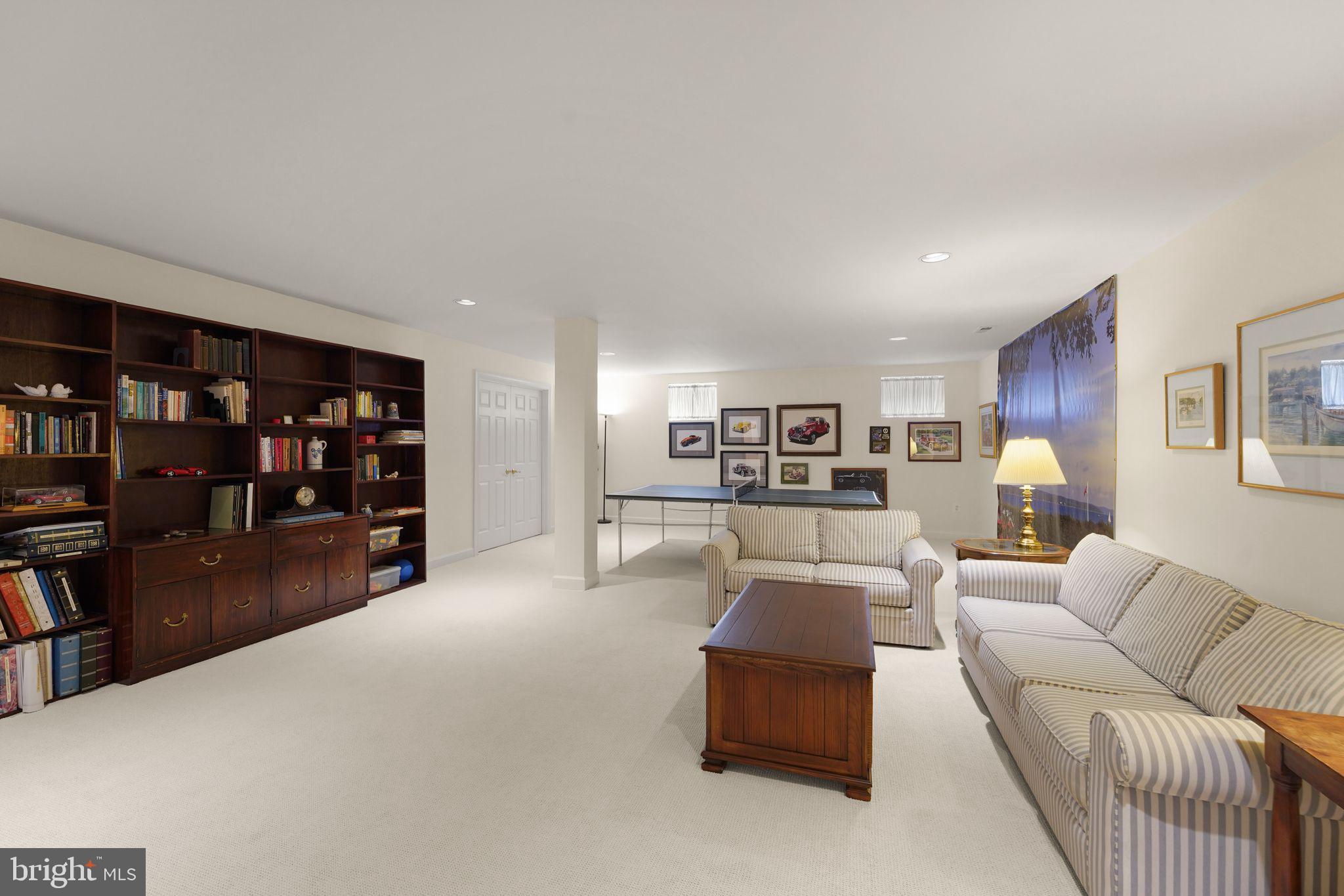6651 Avignon Boulevard Falls Church, VA 22043 - Photo 35 of 51 a living room with furniture and a book shelf