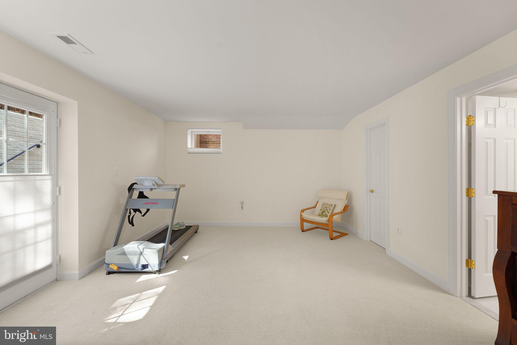 6651 Avignon Boulevard Falls Church, VA 22043 - Photo 37 of 51 a room with a chair and white walls