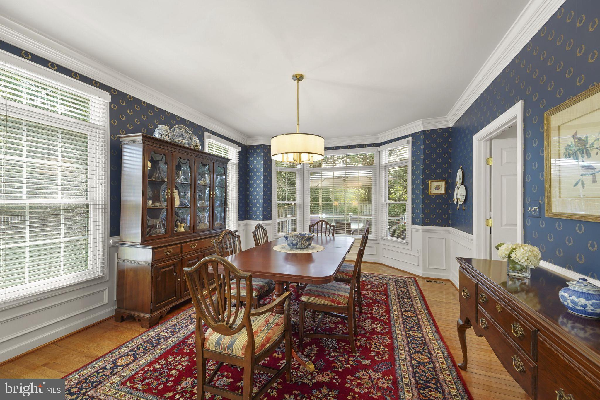 6651 Avignon Boulevard Falls Church, VA 22043 - Photo 8 of 51 a dining room with furniture large windows and wooden floor