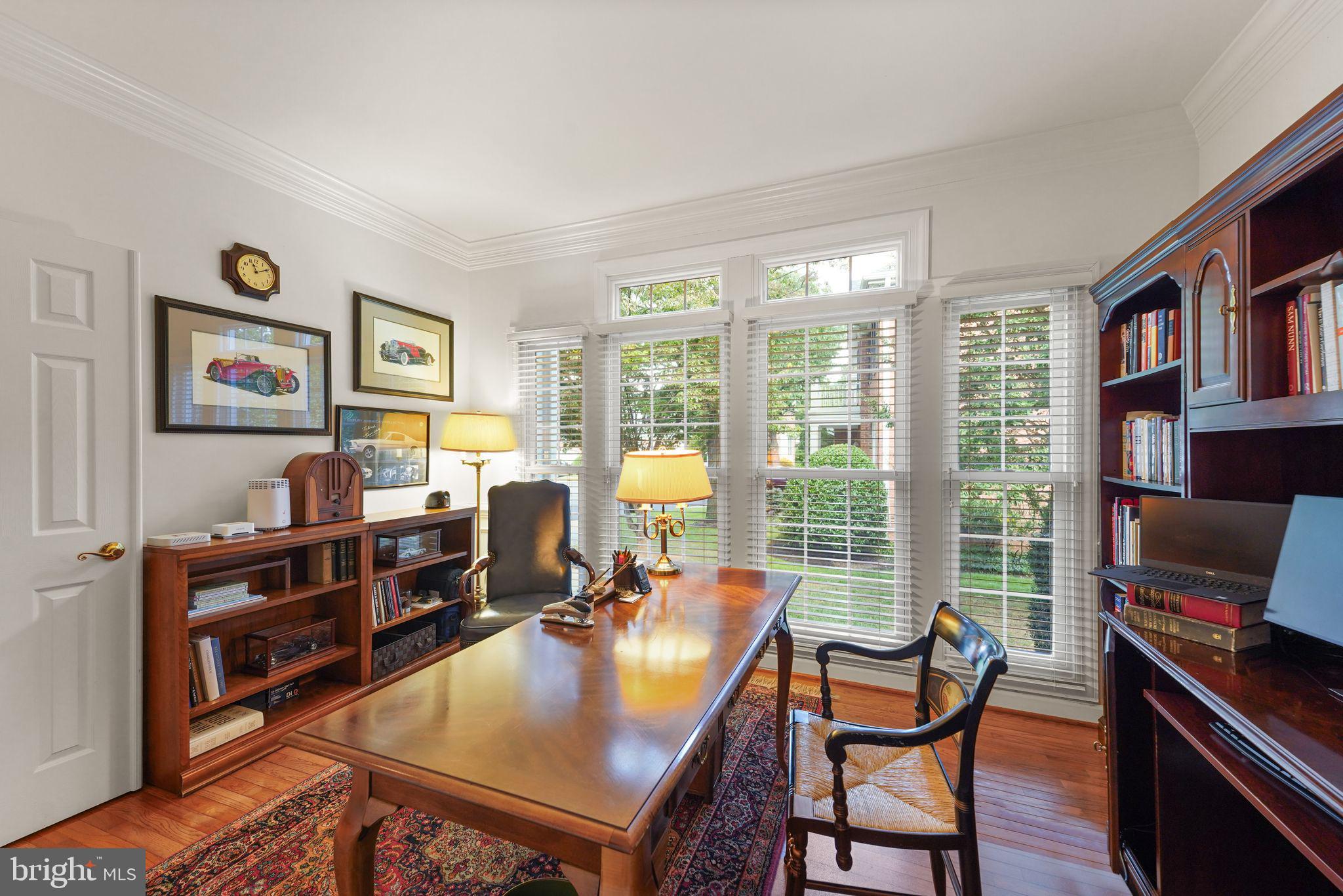 6651 Avignon Boulevard Falls Church, VA 22043 - Photo 10 of 51 a living room with furniture a bookshelf and a window