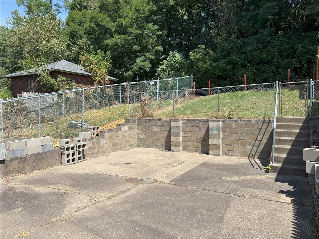 120 Greydon Avenue McKees Rocks, PA 15136 - Photo 5 of 15 a view of a backyard with a slide