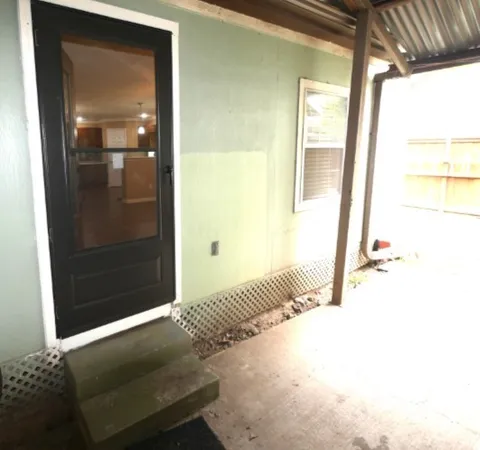 a view of a backyard with sitting area