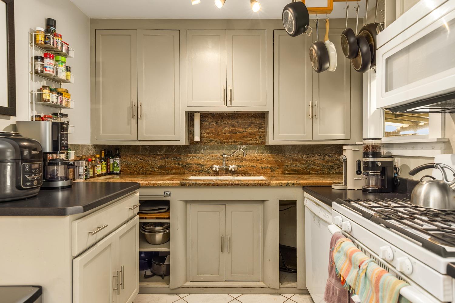302 Bald Street Ojai, CA 93023 - Photo 9 of 38 a kitchen with stainless steel appliances granite countertop a sink stove and cabinets