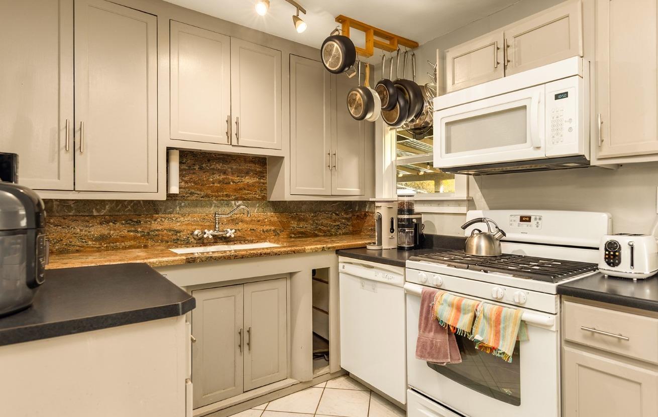 302 Bald Street Ojai, CA 93023 - Photo 10 of 38 a kitchen with cabinets appliances a sink and a counter top space