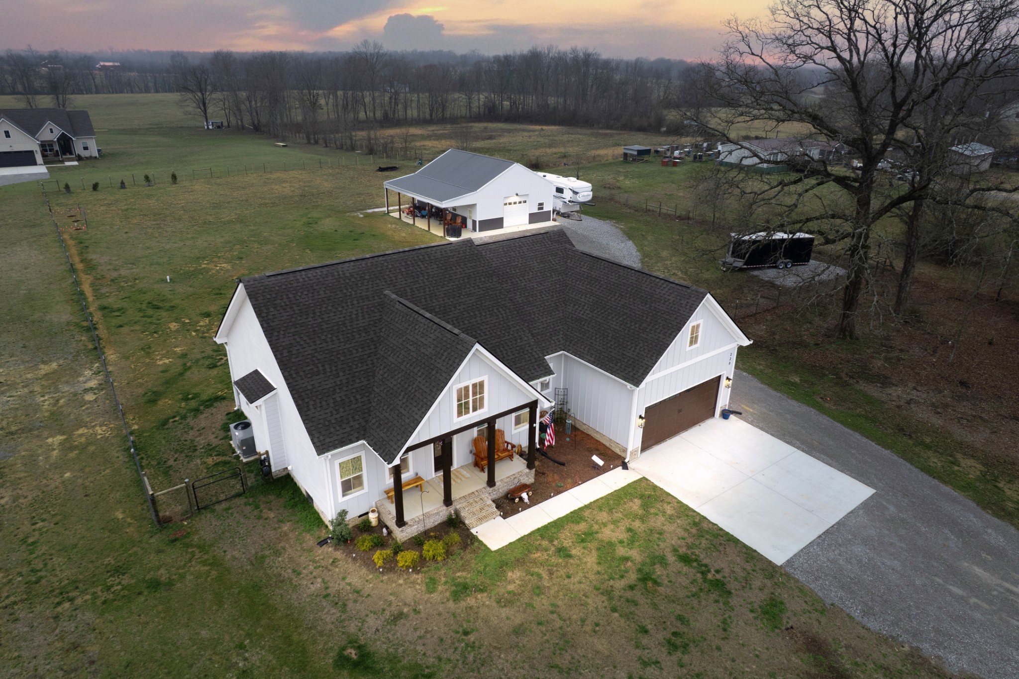 an aerial view of a house having yard and a fountain