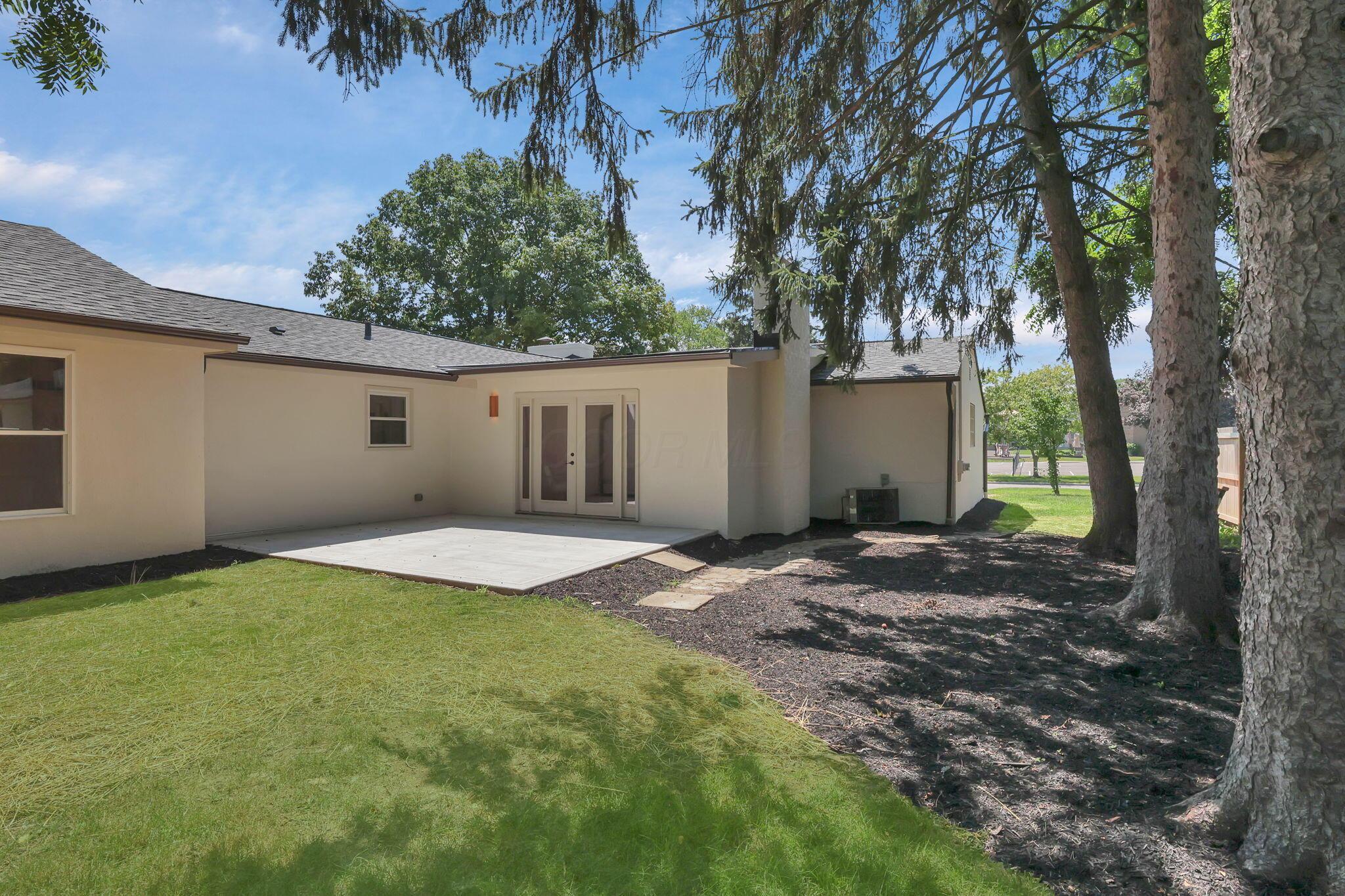3675 Mountview Road Columbus, OH 43220 - Photo 55 of 64 Back patio and yard with mature trees and shade