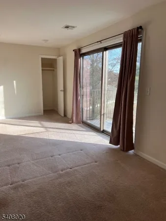 a view of a room with large windows