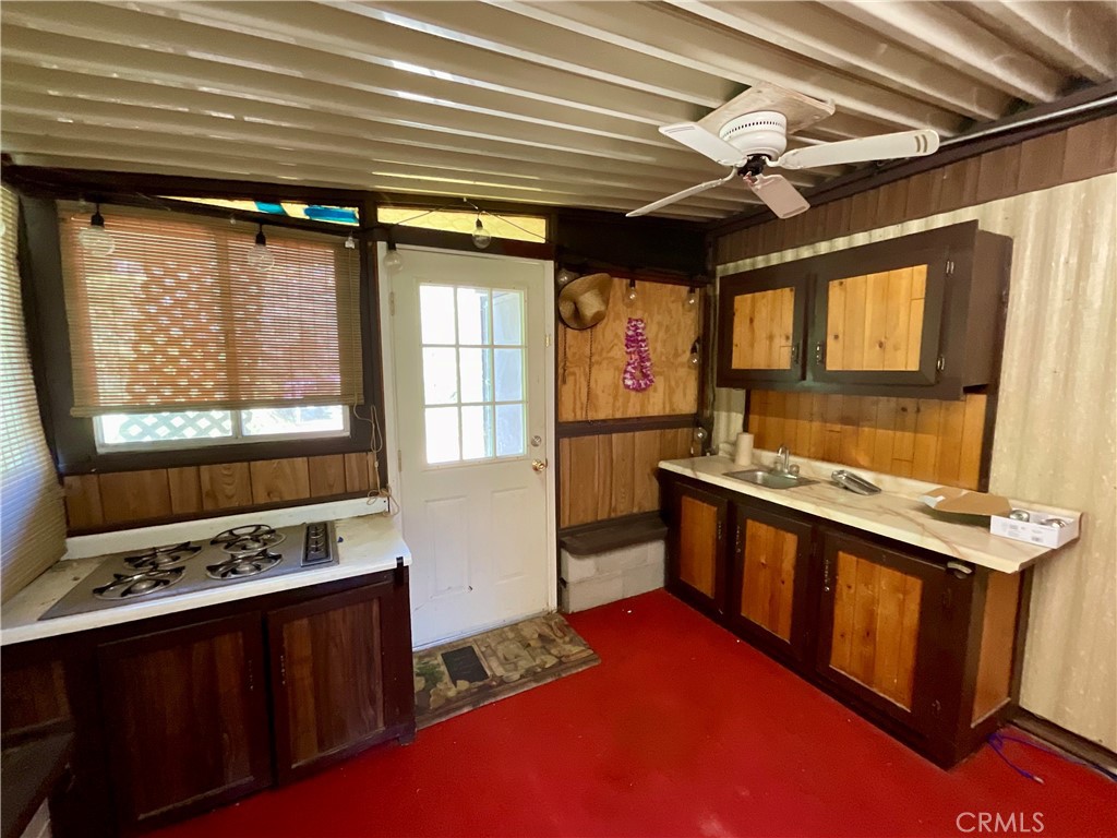 7282 Marin Street Nice, CA 95464 - Photo 36 of 69 a kitchen with a stove a sink and a refrigerator