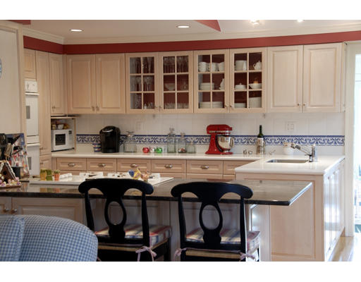 37 Thackeray Road Wellesley, MA 02481 - Photo 3 of 8 a kitchen with stainless steel appliances granite countertop a sink and white cabinets