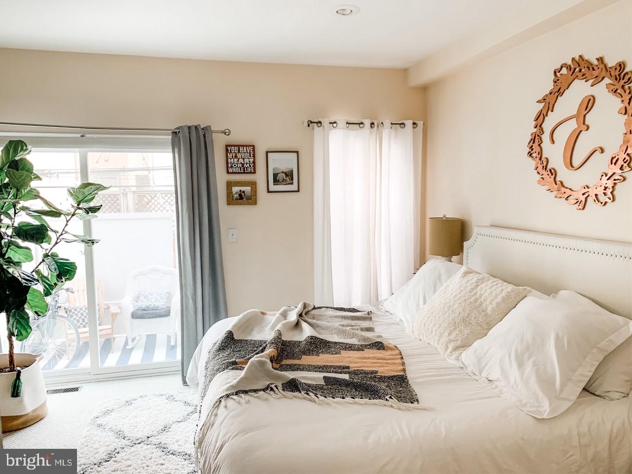 2339 Catharine Street, Unit 1 Philadelphia, PA 19146 - Photo 12 of 29 a bedroom with a bed and a window