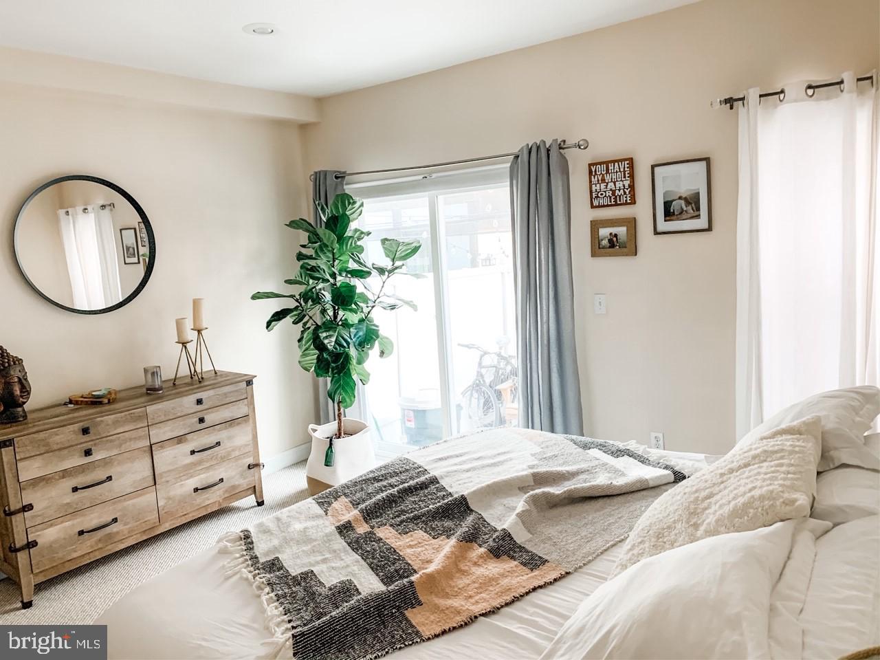 2339 Catharine Street, Unit 1 Philadelphia, PA 19146 - Photo 13 of 29 a bedroom with a bed and a potted plant