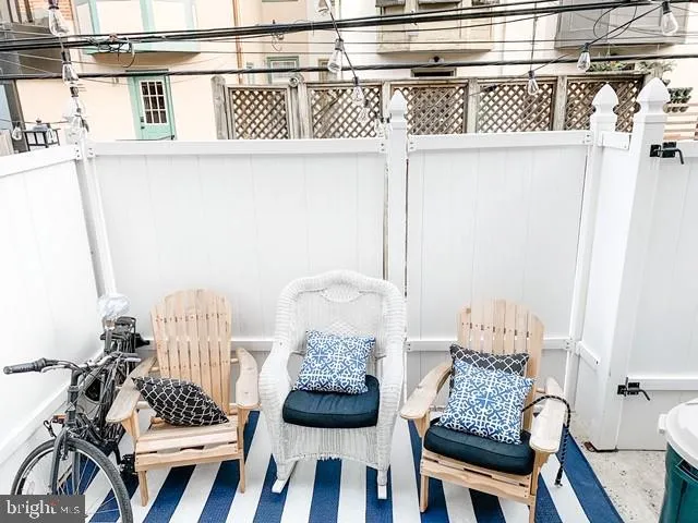 a view of balcony with furniture