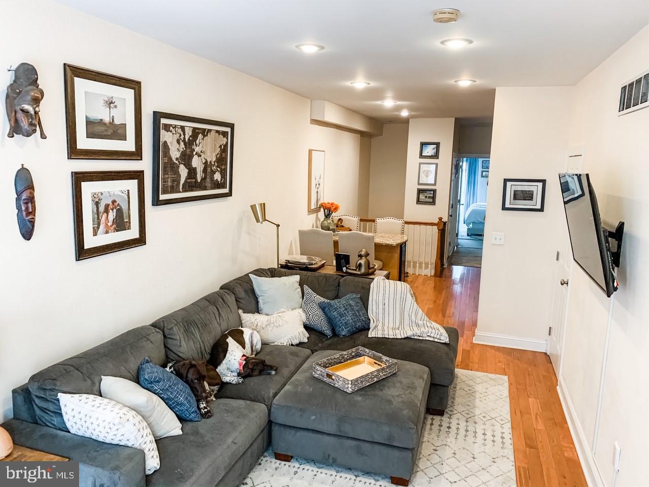 2339 Catharine Street, Unit 1 Philadelphia, PA 19146 - Photo 2 of 29 a living room with furniture and a flat screen tv