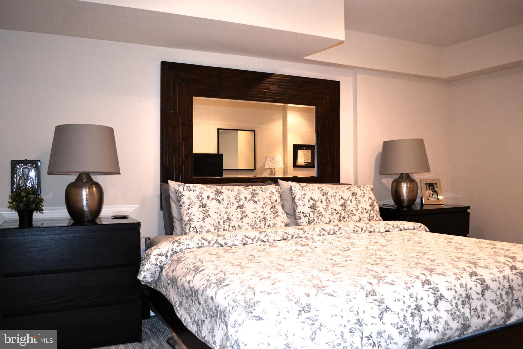 2339 Catharine Street, Unit 1 Philadelphia, PA 19146 - Photo 26 of 29 a bedroom with a bed and a mirror