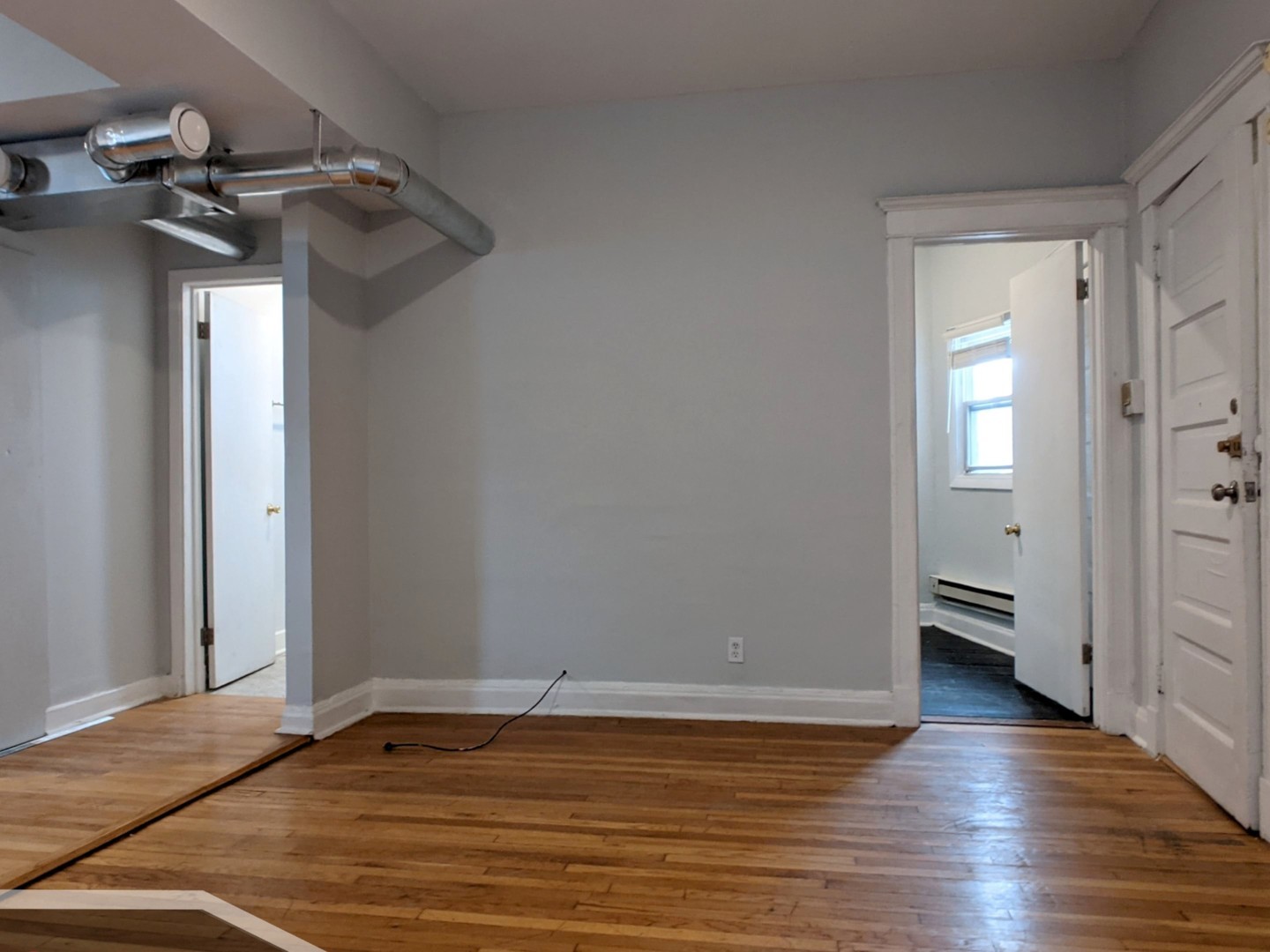 3544 North Halsted Street, Unit 2R Chicago, IL 60657 - Photo 3 of 13 a view of a room with wooden floor