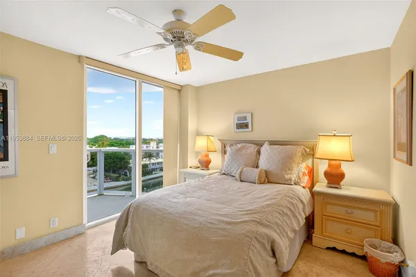 a bedroom with a bed and a couch