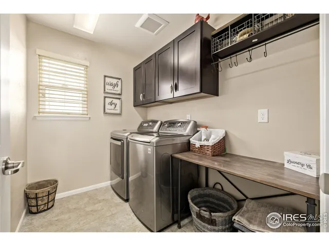 a view of kitchen with cabinets